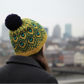Pava golden hat with blurred cityscape